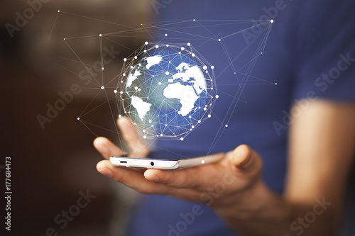 man hand with smartphone and virtual sphere globe