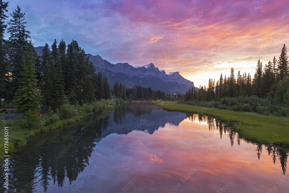 Alberta Foothills Dramatic Burning Red Sunset Sky Landscape in City of Canmore after late afternoon Canadian Rockies summer thunderstorm 