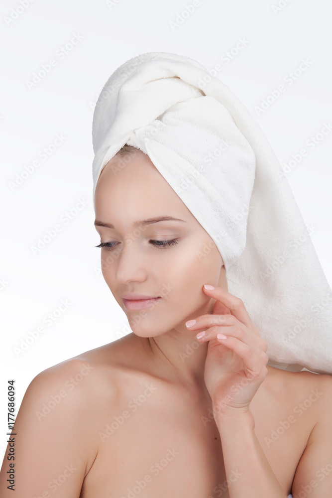 Beauty Woman face Portrait in a towel. Skin Care Concept Isolated on white background Beauty Woman face Portrait in a towel. Skin Care Concept Isolated on white background