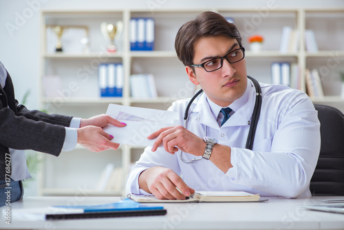 Young doctor in medical insurance fraud concept