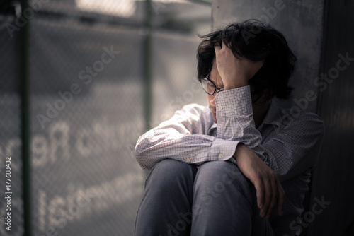 business man is stressed from his work. depression and anxiety concept.