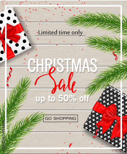 Christmas sale poster with gift boxes, serpentine and tree branches on wooden background. Vector illustration for website and banners, posters, ads, coupons, promotional material