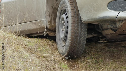 Road emergency situation / Car was stuck in the pit on dirt road, wheel slipping on dry dirt