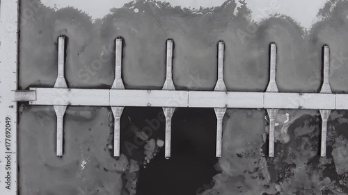 Winter pier, ice-bound top view 4k video
