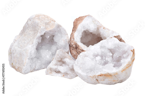 Collection of clear crystal quartz geodes with crystalline druzy center isolated on white background photo