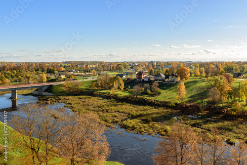 Aerial view on panorama of autumn valley with river and bridge near Bauska town, Latvia © gorelovs