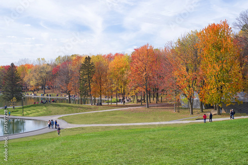 People enjoy a warm autumn day at the Beaver Lake in Mont Royal Park, Montreal