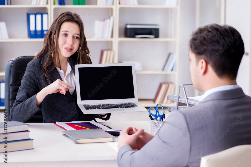 Business meeting between businessman and businesswoman Business meeting between businessman and businesswoman