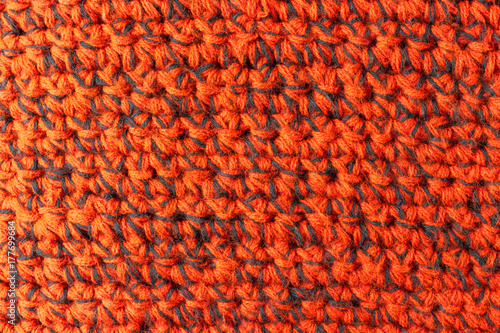 Handmade red knitting texture background photo