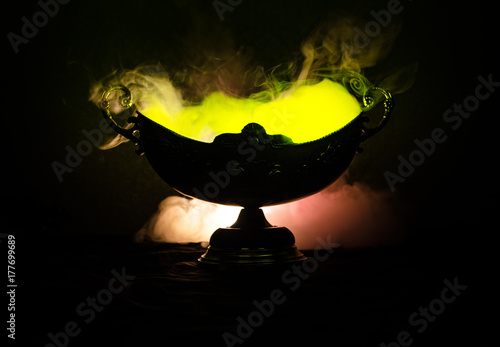 vase handmade on a dark shelf isolated on black. photo