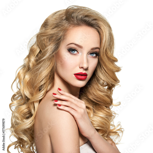 Pretty woman with long hair and red nails