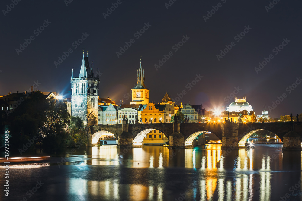 View of  Charles Bridge and Vltava river at night in Prague, Czech Republic
