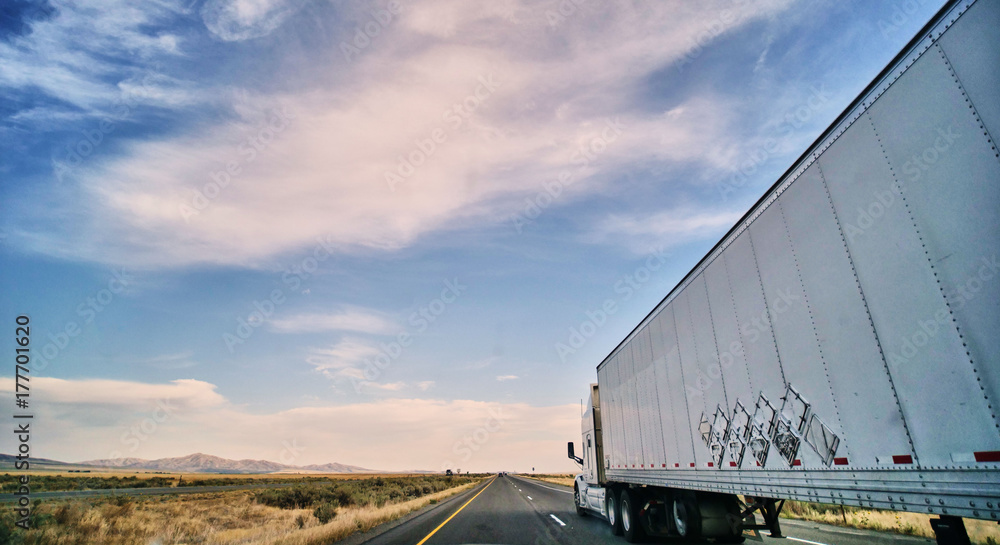 Fototapeta premium freight truck on open highway in desert