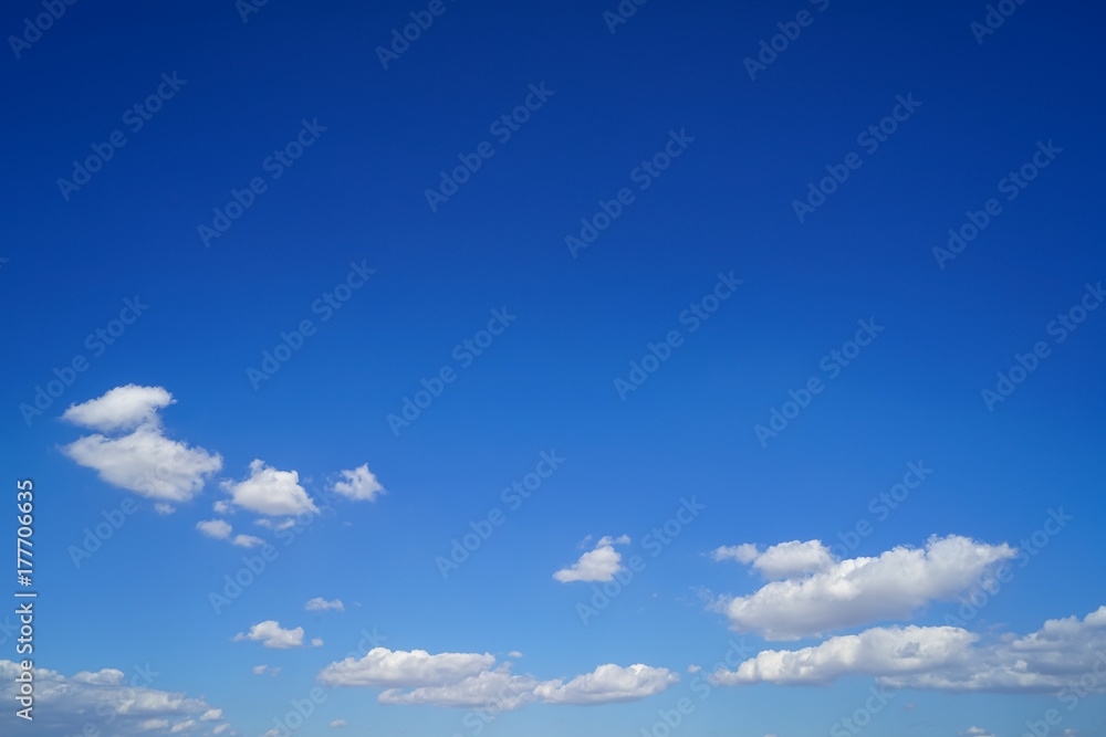Group of free form floating white cloud as per imagination with bright blue sky background on sunshine day Group of free form floating white cloud as per imagination with bright blue sky background on sunshine day