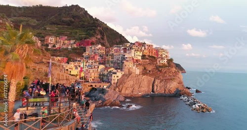 Amazing aerial view of Manarola village on cliff rocks and turquoise sea.Stunning view of beautiful and cozy town in Cinque Terre Reserve,Liguria,Italy,Europe.Travel destination, adventure concept. photo