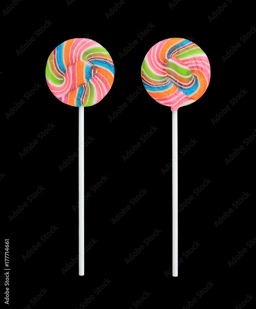 Rainbow color lollipops on black background. Rainbow color lollipops on black background.