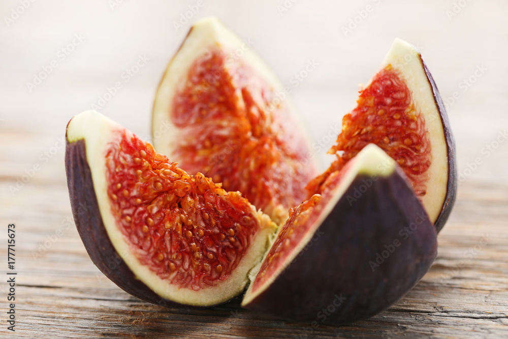 Ripe and sweet fig on wooden table Ripe and sweet fig on wooden table