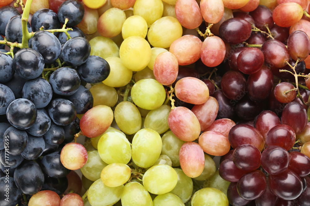 Green, red and blue grapes background