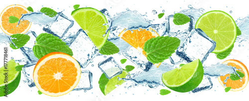 lime and orange splash water and ice isolated