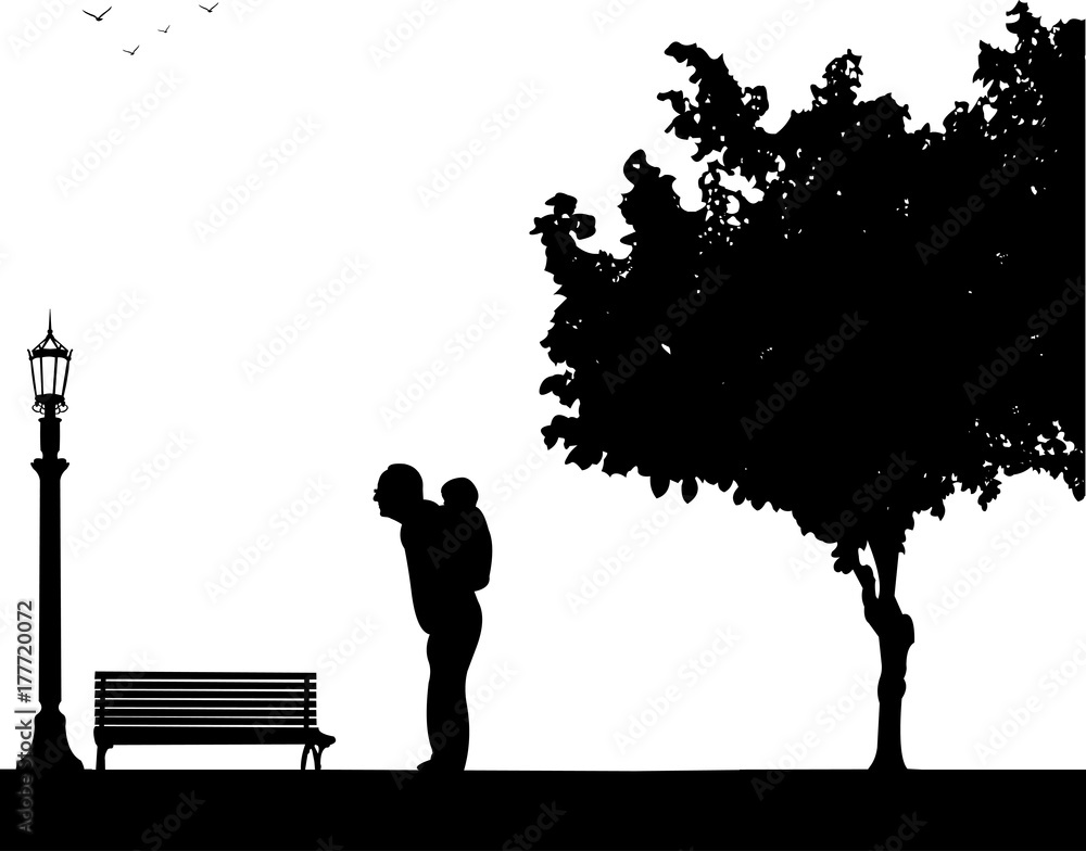 Grandfather carrying a grandchild piggyback in park, one in the series of similar images silhouette Grandfather carrying a grandchild piggyback in park, one in the series of similar images silhouette