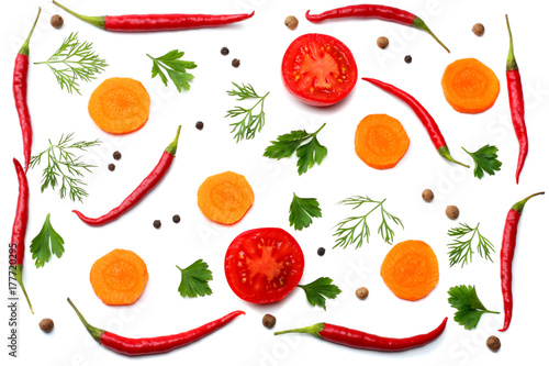 Fototapeta Naklejka Na Ścianę i Meble -  mix red hot chili peppers with parsley and sliced carrot and garlic isolated on white background top view