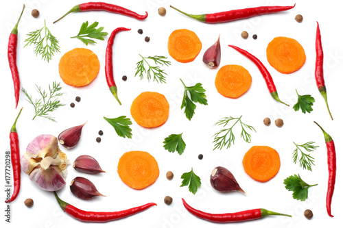 Fototapeta Naklejka Na Ścianę i Meble -  mix red hot chili peppers with parsley and sliced carrot and garlic isolated on white background top view