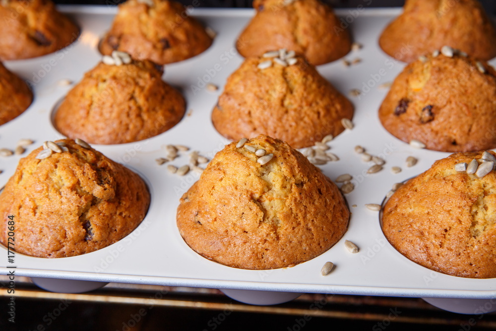 Carrot cupcakes are baked in a hot oven.
