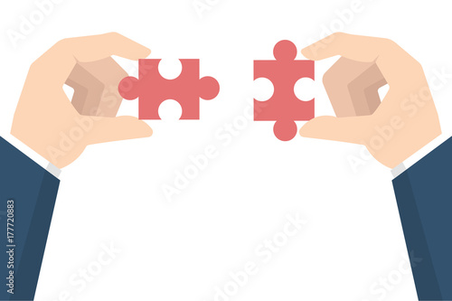 Businessman hands  holding puzzle. Teamwork concept. Vector illustration in flat style