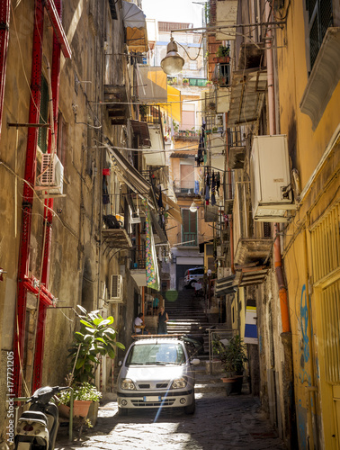 Narrow street in old town of Naples, Italy