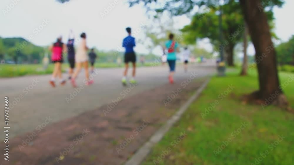 Running and walking blurred focus with exercise at parks outdoor in morning ,concept for health care Running and walking blurred focus with exercise at parks outdoor in morning ,concept for health care