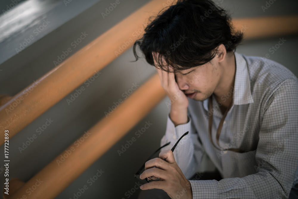 business man is stressed from his work. depression and anxiety concept. business man is stressed from his work. depression and anxiety concept.