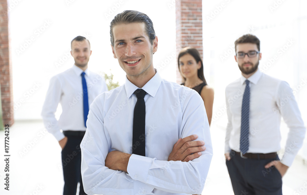 portrait of a successful business person on the background of colleagues. portrait of a successful business person on the background of colleagues.