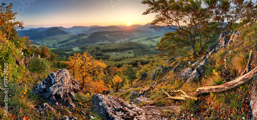 Panorama of sunset in a Carpathian mountain valley with wonderful gold light on a hills © TTstudio