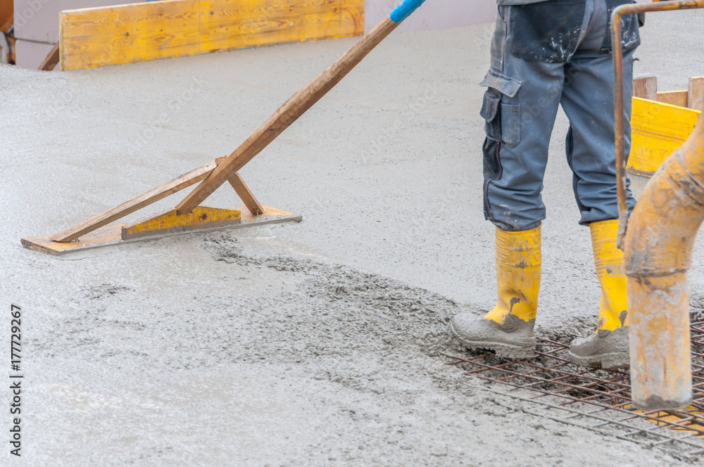 leveling fresh concrete on worksite leveling fresh concrete on worksite