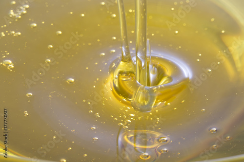 Konstfotografi Closeup of olive oil waterfall.