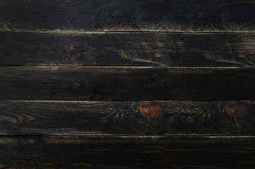 Black painted wood texture background, copy space, top view