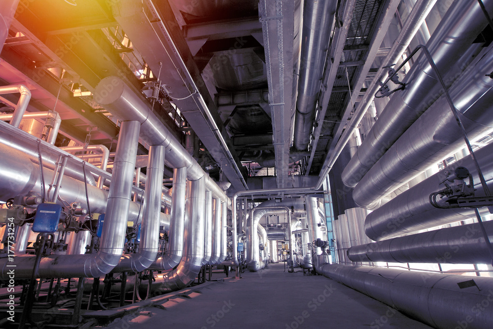 Obraz premium Equipment, cables and piping as found inside of a modern industrial power plant