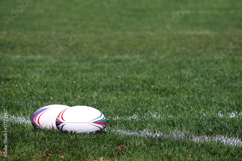 two rugby balls on the field