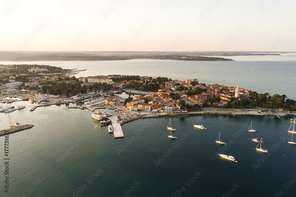 aerial drone view of sunrise over novigrad in summer