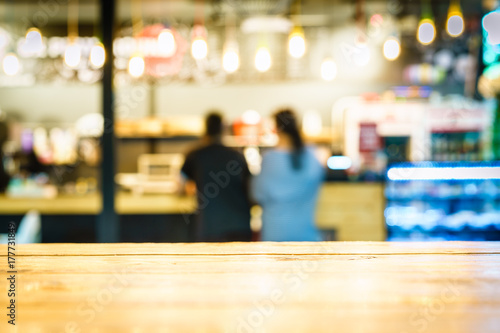 Wallpaper Mural Selective  focus of wooden table in front of decorative indoor string lights. Christmas, festival and holiday concepts, can used for display or montage your products. Torontodigital.ca