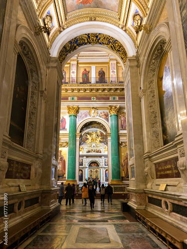 Tourists visiting the interior of St. Isaac's Cathedral. Saint-Petersburg. August 2017.