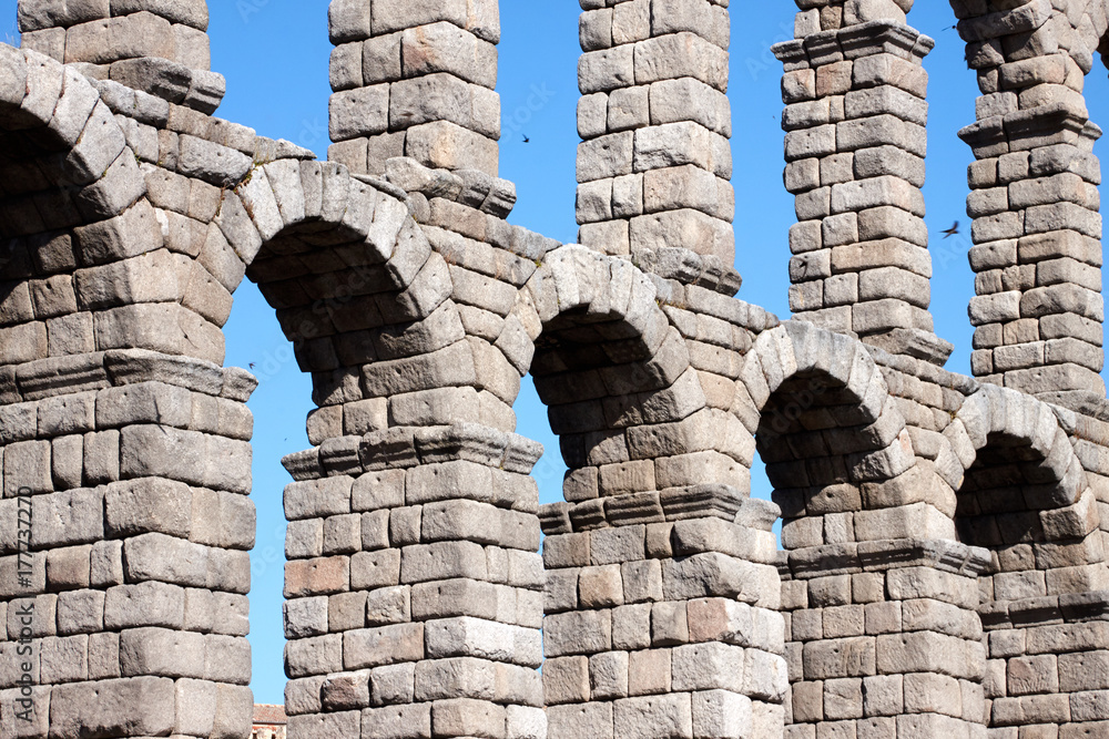 Stone arches of a roman aqueduct in Segovia Spain Stone arches of a roman aqueduct in Segovia Spain