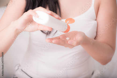 close up of women hands receiving sunblock cream lotion