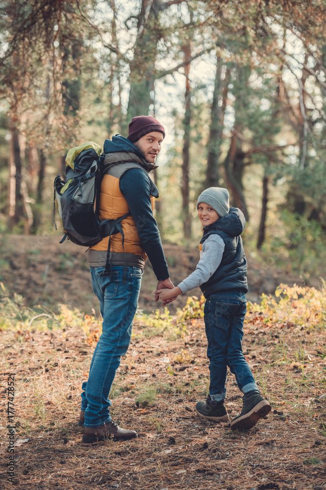father and son hiking together father and son hiking together
