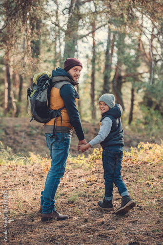 father and son hiking together