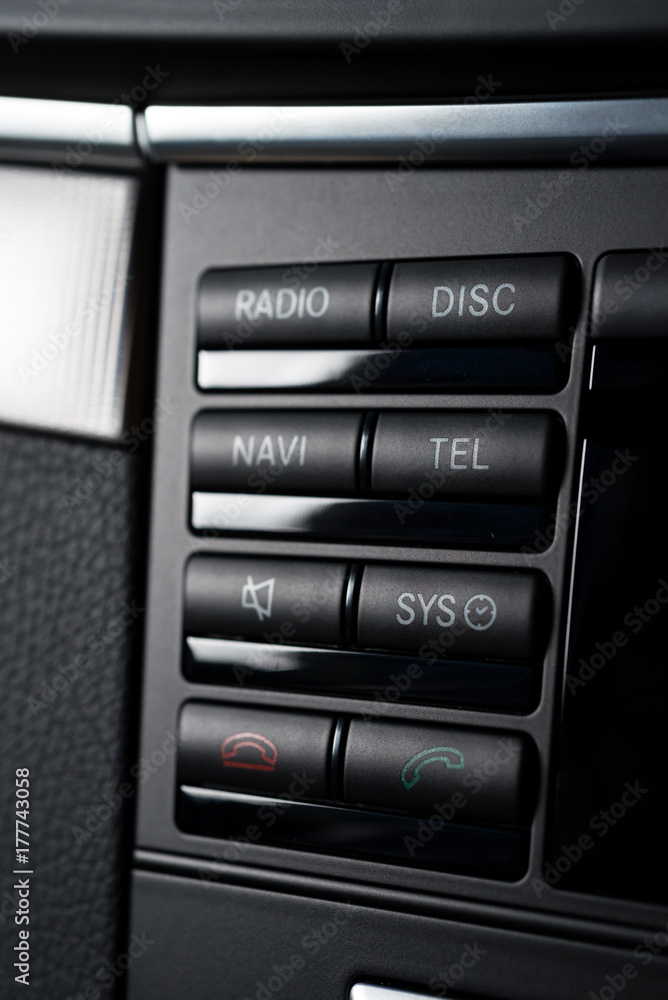 Car detailing series: Closeup of buttons on central control board Car detailing series: Closeup of buttons on central control board