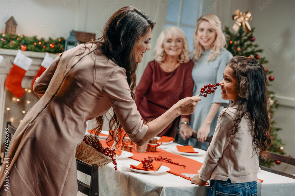 women decorating christmas table