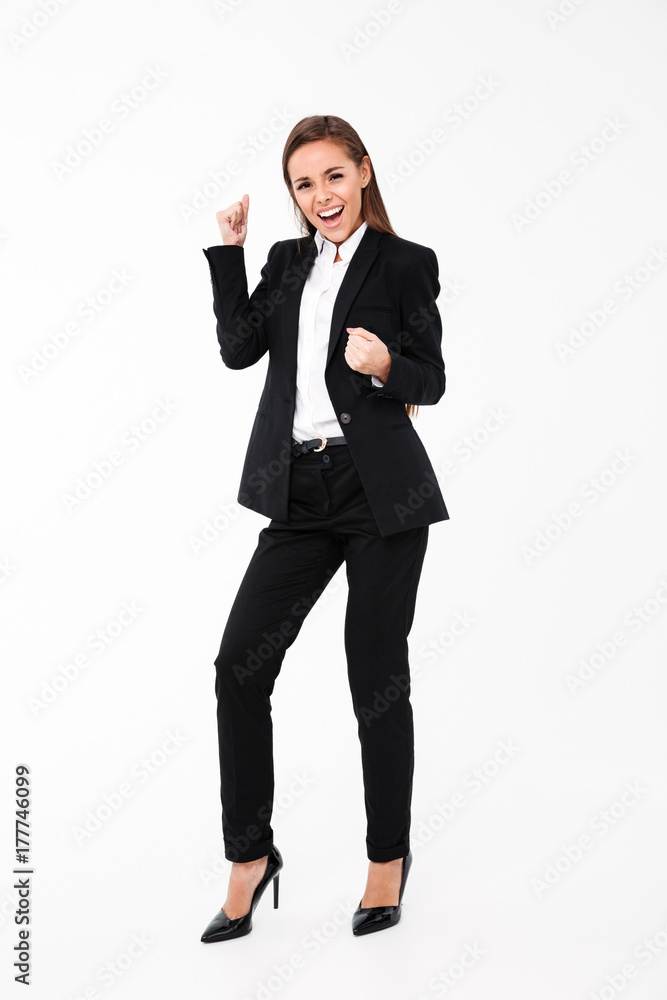 Screaming businesswoman make winner gesture Screaming businesswoman make winner gesture