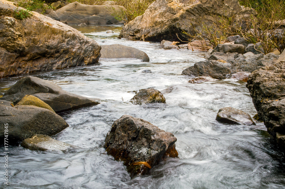 Stones in mountain river in forest. Stones in mountain river in forest.