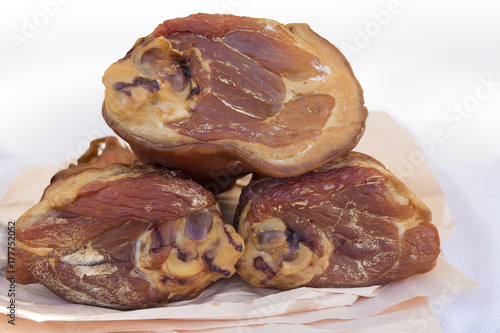 Fotografi Three Smoked ham hock on paper in butcher shop
